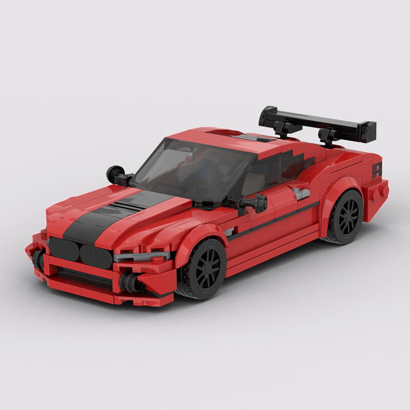 Model Sports Car And Small Particle Building Blocks