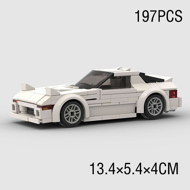 Model Sports Car And Small Particle Building Blocks